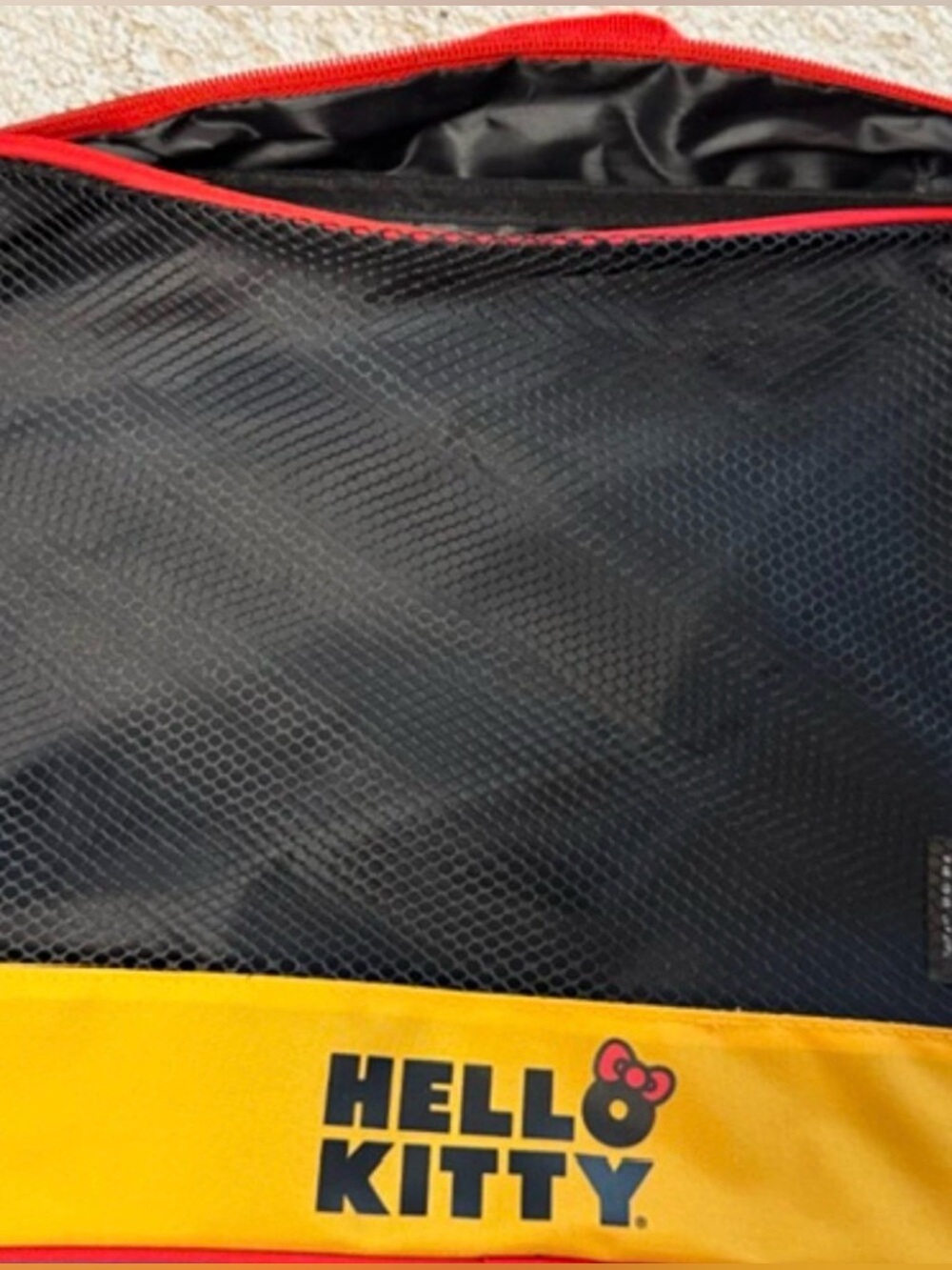 NWOT Mesh Hello Kitty Packing Bag. Free with any $30 purchase!